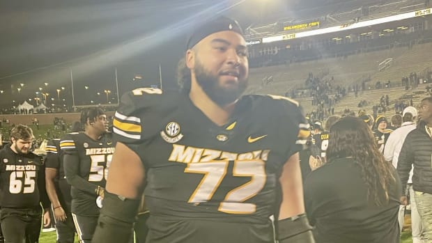 Missouri offensive lineman Xavier Delgado carries his rock afetr winning his last game at Memorial Stadium.